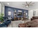 Inviting living room with a board and batten accent wall and comfortable seating at 3522 E Penedes Dr, Gilbert, AZ 85298