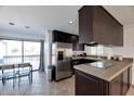 Modern kitchen with stainless steel appliances and breakfast bar at 6240 N 16Th St # 45, Phoenix, AZ 85016