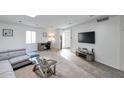 Bright living room with TV, desk, and a view of the front door at 6240 N 16Th St # 45, Phoenix, AZ 85016