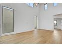 Spacious living room with soaring ceilings and large windows providing natural light at 100 W Northern Ave # 4, Phoenix, AZ 85021