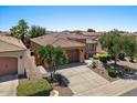 Well-kept single-story home with desert landscaping, tile roof, and convenient two-car garage at 1449 E Artemis Trl, Queen Creek, AZ 85140