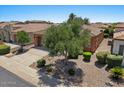 Single-story home with a tile roof and desert landscaping; includes a private driveway at 1449 E Artemis Trl, Queen Creek, AZ 85140