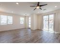 Spacious living room featuring recessed lighting, wood-look flooring, and sliding glass doors at 300 N Gila Springs Blvd # 144, Chandler, AZ 85226