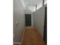 Welcoming entryway features wood-look floors and accent wall paneling at 11590 W Cocopah St, Avondale, AZ 85323