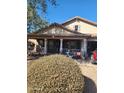 Inviting single-story home with a charming front porch and manicured landscaping at 11590 W Cocopah St, Avondale, AZ 85323