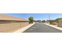 Picture of a quiet residential street showcasing well-maintained homes and sidewalks at 11590 W Cocopah St, Avondale, AZ 85323