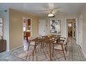 Cozy dining area with wood table, fan, and bright light perfect for entertaining at 130 E Coronado Rd # 16, Phoenix, AZ 85004
