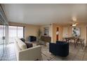 Spacious open-concept living room flows into the dining area with neutral tones and modern fixtures at 130 E Coronado Rd # 16, Phoenix, AZ 85004