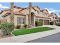 Inviting home exterior with a lush lawn and mature landscaping adding to its charm at 14841 N 62Nd Way, Scottsdale, AZ 85254