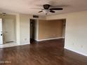 Open-concept living room with hardwood flooring, plenty of natural light at 16805 N 110Th Ave, Sun City, AZ 85351