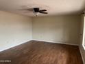 Spacious living room featuring hardwood floors and a modern ceiling fan at 16805 N 110Th Ave, Sun City, AZ 85351