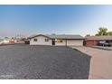 Charming one-story home with a well-maintained exterior and inviting entrance with a gravel yard at 1718 S Marilyn Ann Dr, Tempe, AZ 85281