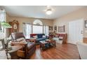 Cozy living room with hardwood floors, natural light, and comfortable seating at 17200 W Bell Rd # 1643, Surprise, AZ 85374