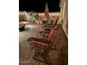 Inviting outdoor patio featuring comfortable seating and string lights for evening enjoyment at 289 W Ironhorse Ln, San Tan Valley, AZ 85143