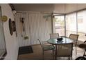 Inviting sunroom provides a cozy place to relax or entertain with view of the outdoors at 303 S Recker Rd # 218, Mesa, AZ 85206