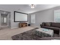 Large living room with a big screen projector at 3129 E Franklin Ave, Gilbert, AZ 85295