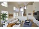 Bright, spacious living room featuring high ceilings, stylish furniture, and large windows for ample natural light at 3564 N Tuscany --, Mesa, AZ 85207