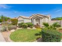 Inviting home featuring desert landscaping and a well-manicured lawn at 3871 S Marion Way, Chandler, AZ 85286