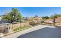 The balcony overlooks a fenced backyard and artificial turf at 4050 W Camino Del Rio --, Glendale, AZ 85310