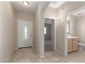 Bright entryway featuring neutral walls, tiled floors, and views into the home's open layout at 4176 E Bonanza Rd, Gilbert, AZ 85297