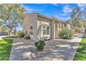 Attractive single story home featuring neutral stucco and low maintenance rock landscaping at 500 N Roosevelt Ave # 61, Chandler, AZ 85226