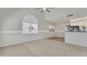 Bright living room with high ceilings, large windows and carpet floors at 500 N Roosevelt Ave # 61, Chandler, AZ 85226