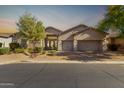 Attractive single story home with a three car garage, desert landscaping and inviting curb appeal at 6209 E Bramble Berry Ln, Cave Creek, AZ 85331