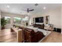 Inviting living room with hardwood floors, modern furnishings, and large windows at 6209 E Bramble Berry Ln, Cave Creek, AZ 85331