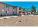 Exterior view of the apartment complex showcasing its well-maintained grounds, and walkways at 623 W Guadalupe Rd # 214, Mesa, AZ 85210