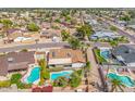 Beautiful aerial shot of a neighborhood, featuring a home with a private pool and well-maintained backyard at 6608 S Willow Dr, Tempe, AZ 85283