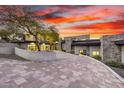 Stunning home featuring stone accents, a glass garage door, and desert landscaping at 9127 N Fireridge Trl, Fountain Hills, AZ 85268