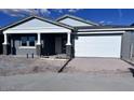 Charming single-story home featuring a two car garage and rock accents at 32155 N Lone Rancher Way, San Tan Valley, AZ 85140