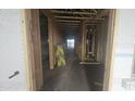 Interior view of a home under construction, showing framing and unfinished flooring at 32155 N Lone Rancher Way, San Tan Valley, AZ 85140