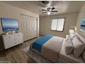 Cozy bedroom with a large closet, modern ceiling fan, and natural light from the window at 4734 N 61St Ave, Phoenix, AZ 85033