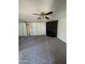 Cozy living room featuring plush carpeting and a fireplace, great for relaxing evenings at 4820 N 89Th Ave # 45, Phoenix, AZ 85037