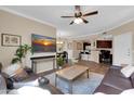 Spacious living room featuring a ceiling fan, wood-look floors and comfortable seating at 20801 N 90Th Pl # 242, Scottsdale, AZ 85255