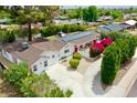 Single story home featuring solar panels, mature landscaping and circular driveway at 6747 N 12Th St, Phoenix, AZ 85014