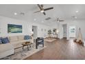 Spacious open-concept living area with modern furniture, stylish décor and hardwood floors at 6747 N 12Th St, Phoenix, AZ 85014