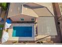 This property boasts a refreshing pool, perfect for relaxation, and a shaded patio area for outdoor enjoyment at 3302 E Lantana Pl, Chandler, AZ 85286
