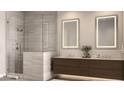 Modern bathroom with double vanity, illuminated mirrors, and a luxurious glass-enclosed shower with stone accents at 4849 N Camelback Ridge Rd # A309, Scottsdale, AZ 85251