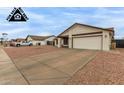 Single-story home with a spacious driveway and a two-car garage at 8007 W Corrine Dr, Peoria, AZ 85381