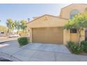 Inviting home exterior showcasing a two-car garage and desert-friendly landscaping at 1367 S Country Club Dr # 1276, Mesa, AZ 85210