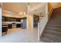 Open floor plan showcasing the kitchen, living area, and staircase with modern finishes at 1367 S Country Club Dr # 1276, Mesa, AZ 85210