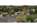 Bird's eye view of home featuring a large parking lot, pristine landscaping, and a private entrance at 1522 W Myrtle Ave, Phoenix, AZ 85021