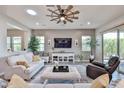 Spacious living room boasts lots of natural light, neutral colors, and stylish décor at 20631 W Minnezona Ave, Buckeye, AZ 85396
