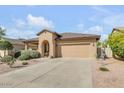Inviting single-story home featuring a two car garage and well maintained landscaping at 2857 N Mystic Ct, Casa Grande, AZ 85122