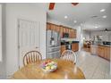 Charming kitchen with stainless steel appliances, and adjacent dining area at 2857 N Mystic Ct, Casa Grande, AZ 85122
