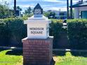 Elegant Windsor Square community sign featuring classic typography and brick base, set amidst lush greenery at 302 E Orange Dr, Phoenix, AZ 85012