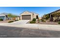 Single-story home with desert landscaping, neutral paint, and a driveway leading to a two-car garage at 3670 E Sandoval Dr, San Tan Valley, AZ 85140