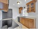 The kitchen features wood cabinets, granite countertops, and stainless steel appliances at 4554 E Paradise Village Pkwy # 161, Phoenix, AZ 85032